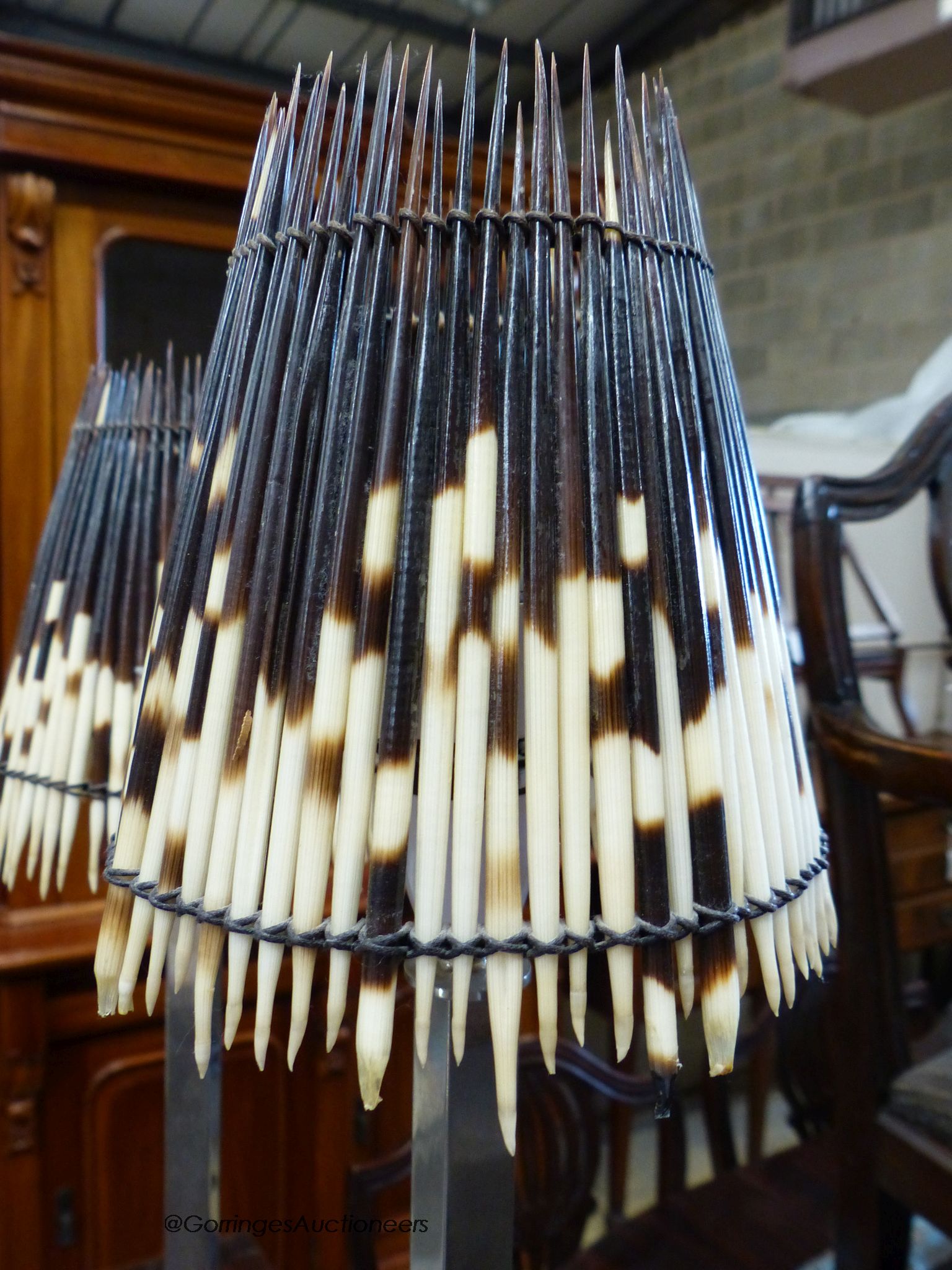 A pair of chrome table lamps with Porcupine quill shades by Andrew Martin, H-75cm